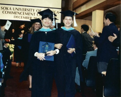 Graduates walk down aisle after receiving diplomas